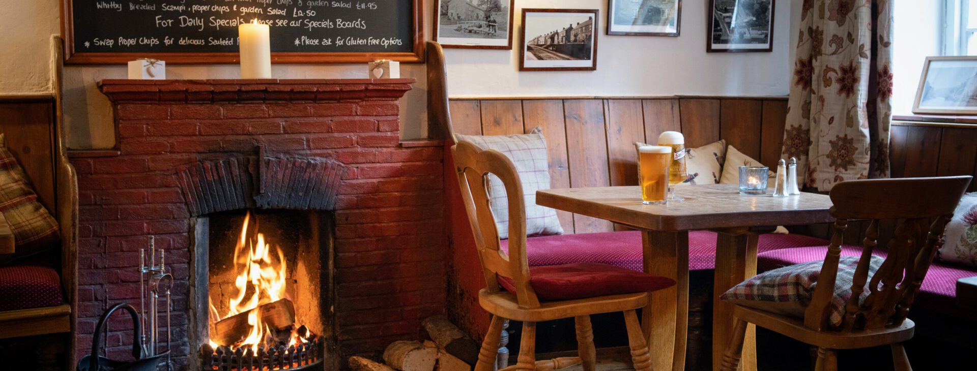 cosy bar room with roaring log fire